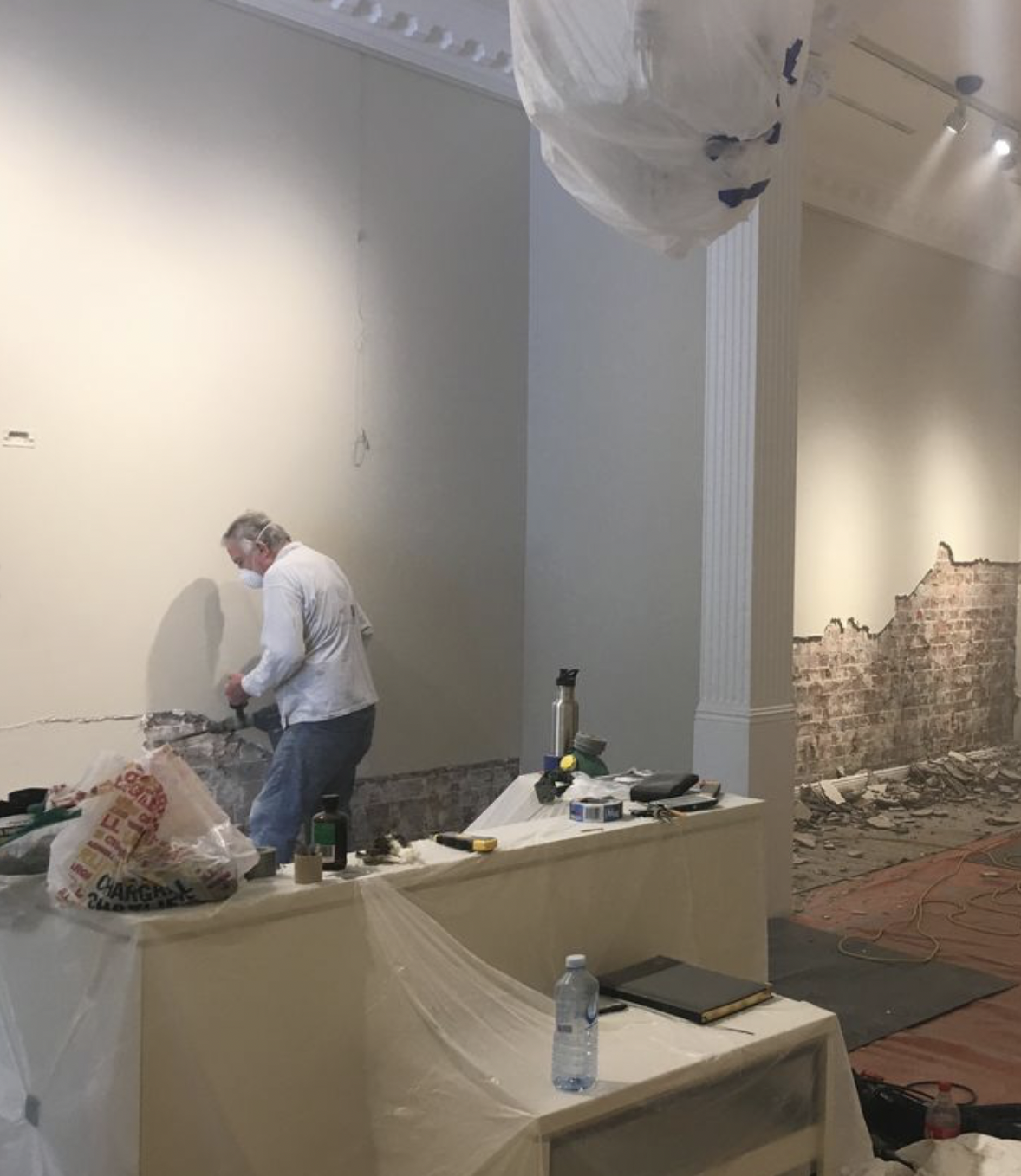 Roger treating rising damp on an interior wall in Sydney